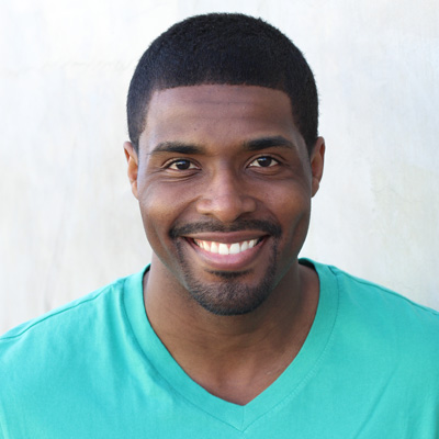 An elderly couple sharing a warm embrace, smiling and radiating contentment.